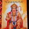 'Hanuman Upasana' in Hindi, featuring a vibrant illustration of Lord Hanuman kneeling with a mace, set against an orange background."