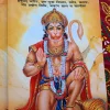 Book cover for 'Hanuman Upasana' in Hindi, featuring a vibrant illustration of Lord Hanuman kneeling with a mace, set against an orange background." "Apan Mithila" todayuse.com