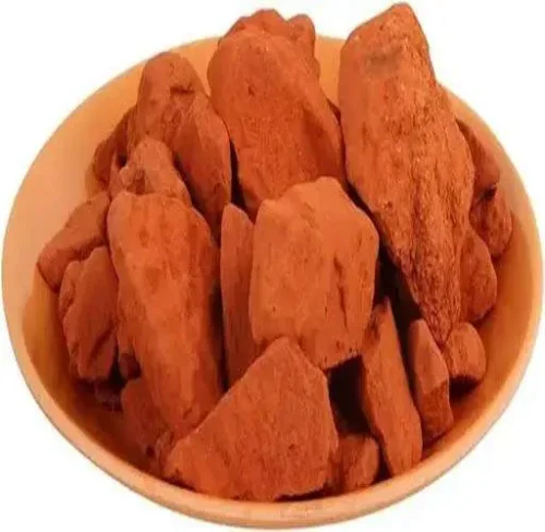 A natural earth pigment that ranges in color from yellow to deep orange or brown.