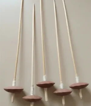 Wooden supported spindles with clay whorls, used for hand-spinning cotton fibers into yarn. Apan Mithila Todayuse Mithilause Mithila use