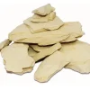 A woman applying a thick, creamy grey-brown paste of Multani mitti face pack